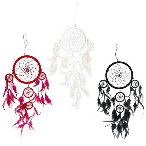 Large round dreamcatcher in black, white and red with woven thread and beads, hanging over a wooden frame