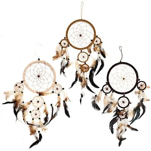 Large round dreamcatcher in cream, coffee, and chocolate tones with woven net and hanging tassels.