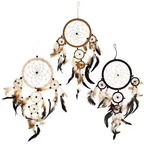 Cream dreamcatcher in large round design, featuring woven net and decorative fringe in natural colors