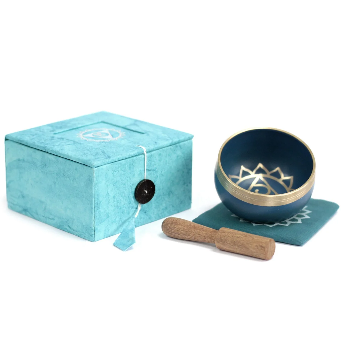 Throat chakra bowl in metal, displayed on a wooden surface with gentle light reflections, classic circular shape
