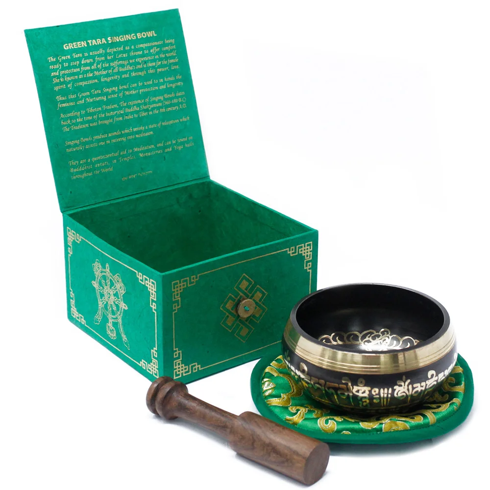 10cm singing bowl set – small green Tara bowl with polished metal, reflecting light.