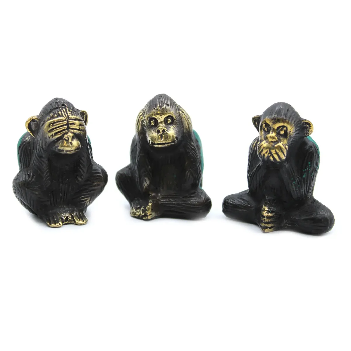 Set of 3 see no evil monkeys figurines displayed together in a playful arrangement