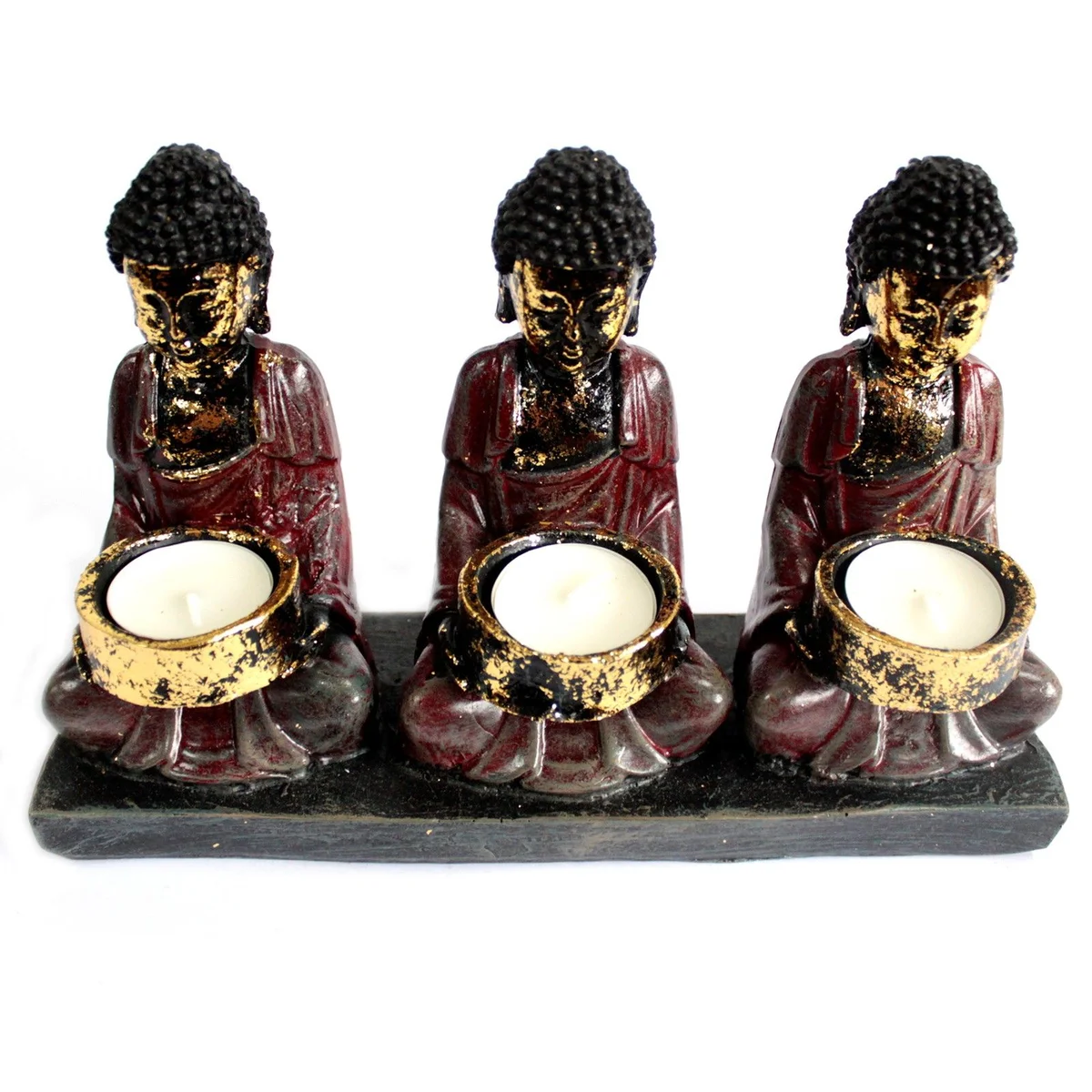 Antique Buddha candle holder with bronze Buddha and three devotees holding candles.