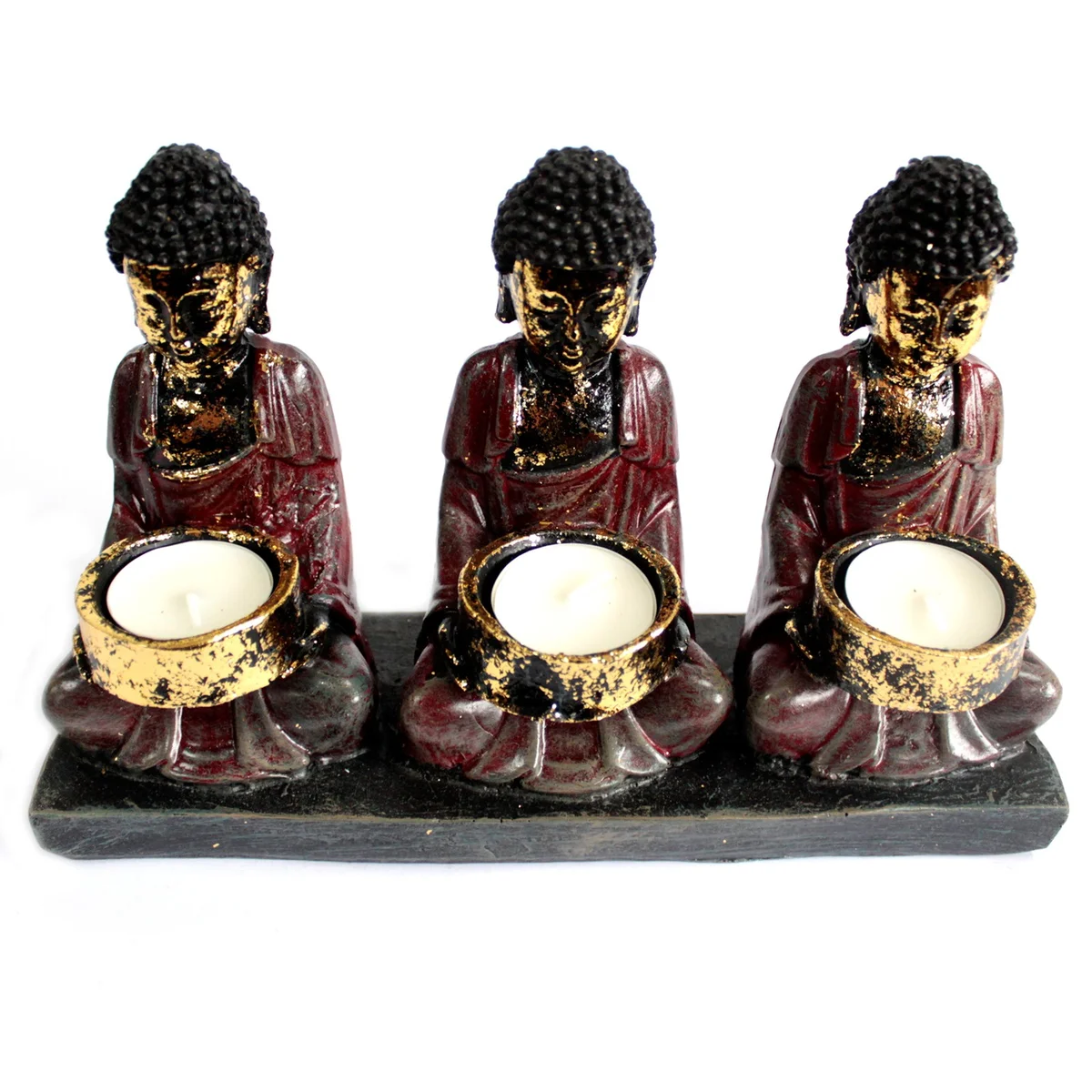 Antique candle holder featuring a Buddha statue with three devotees holding candles, depicted in a detailed ceramic style.