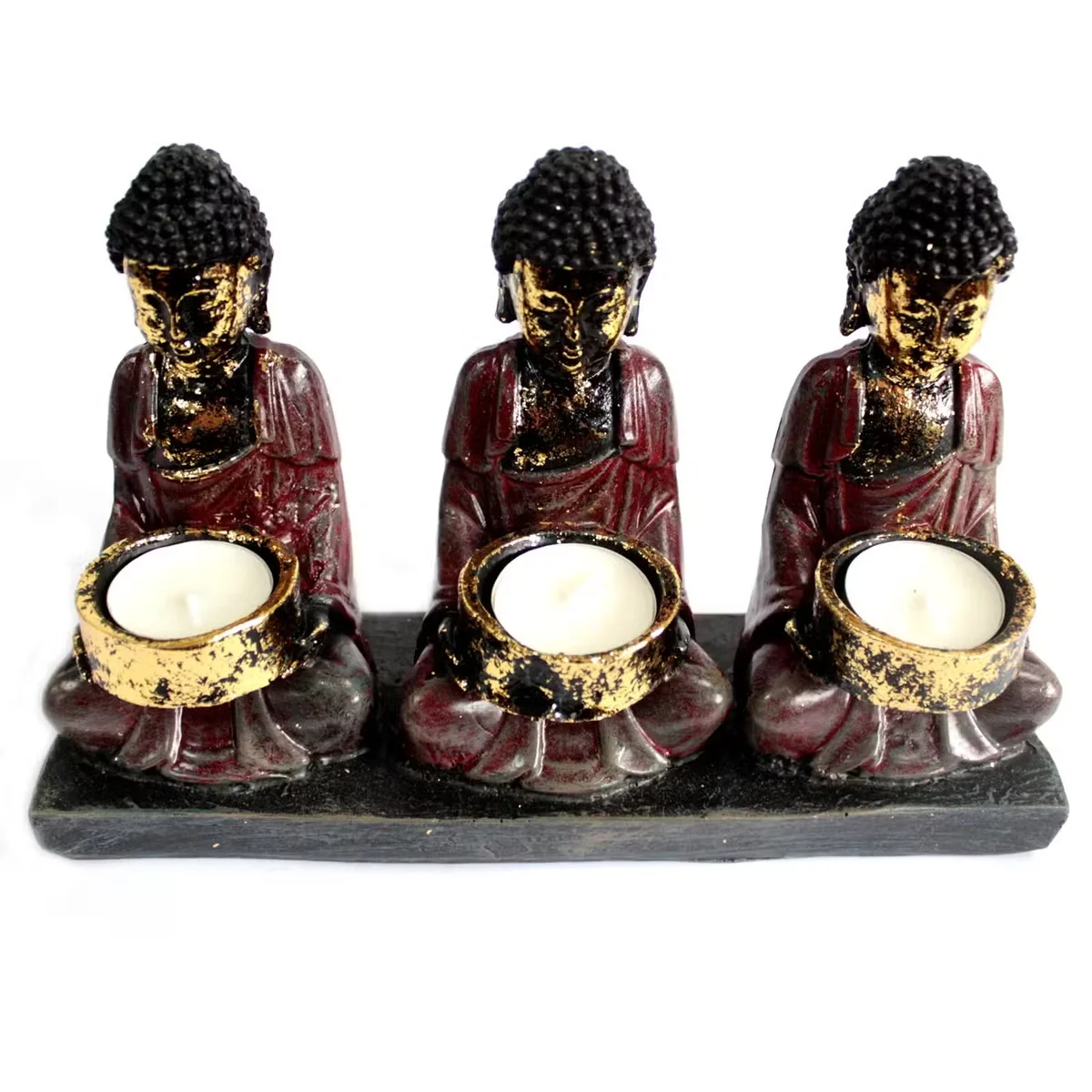 Antique Buddha with the three devotees candle holder, showing Buddha surrounded by three devotees holding candles.