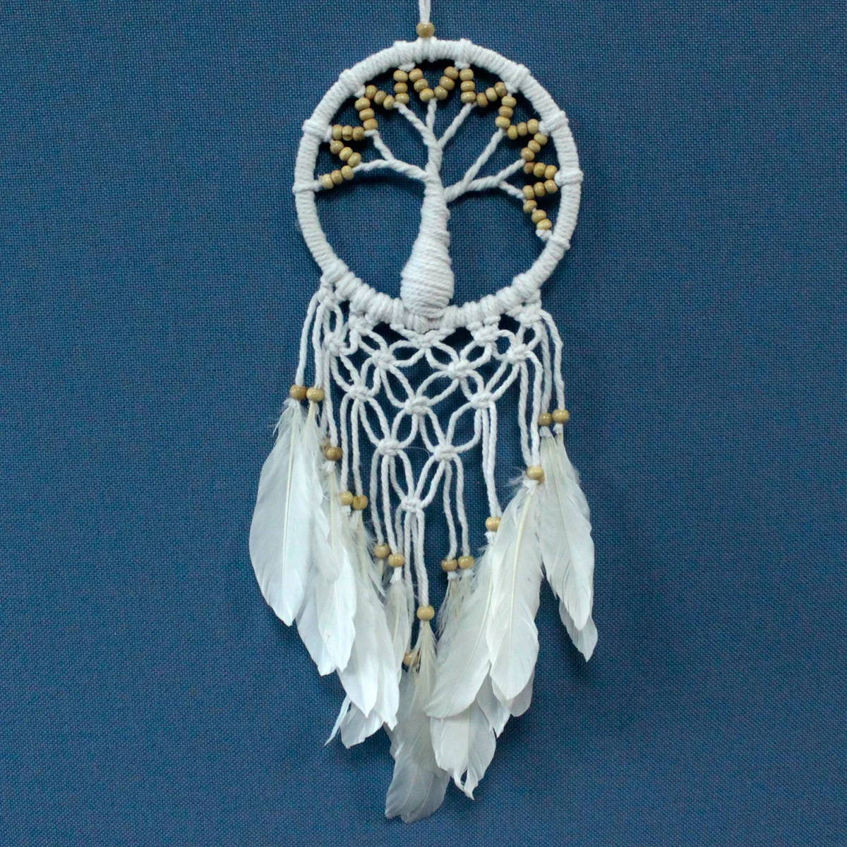 16cm dreamcatcher featuring a natural tree of life design, woven with twine and feathers.
