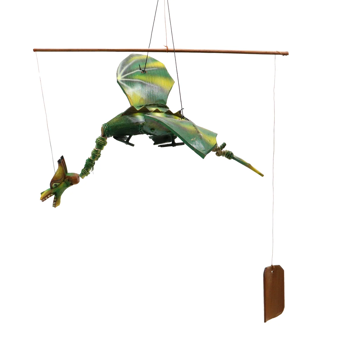 Green coconut dragon mobile, 37cm, hanging from ribbon in a bright room, whimsical decor.