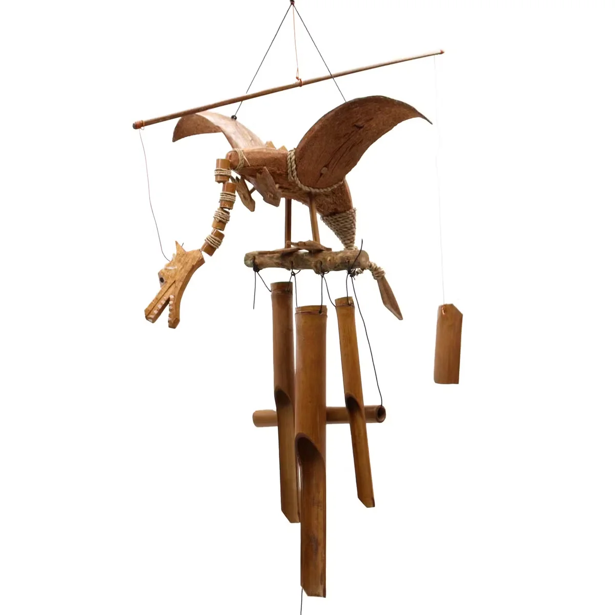 Coconut Dragon wind chime hanging in a garden, with a purple dragon motif on a coconut rope.