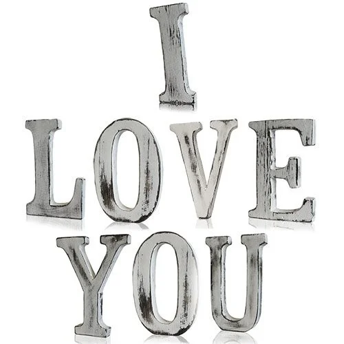 Shabby chic I LOVE YOU wall art on a wall.