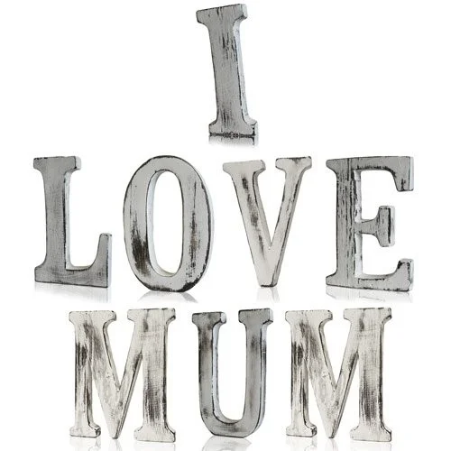 Distressed wooden letters arranged to read I LOVE MUM, showcasing love mum letters in a shabby chic style.