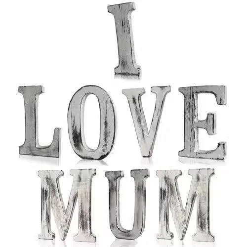 Shabby chic love mum letters set in wooden frame spelling I LOVE MUM, styled with rustic charm.