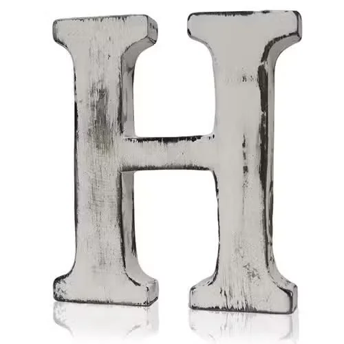 Stylish H letter plastered in shabby chic wall art style, grungy painted edges.