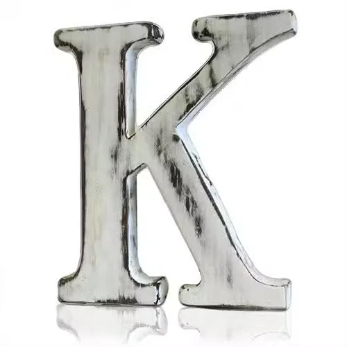 Shabby chic alphabet letter K in distressed rustic finish, showcasing worn wooden texture