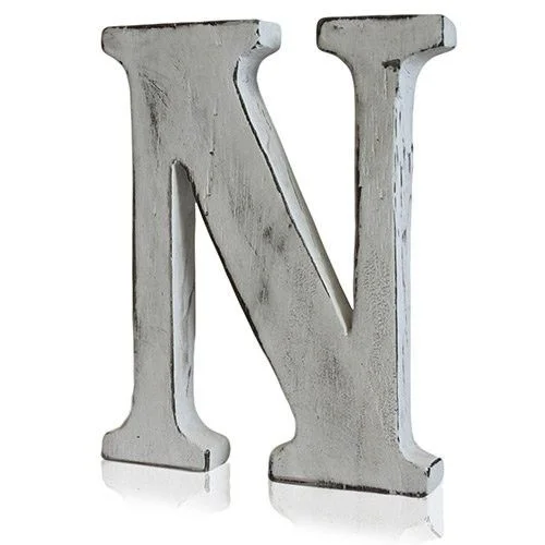 shabby chic N letter displayed on a plain backdrop