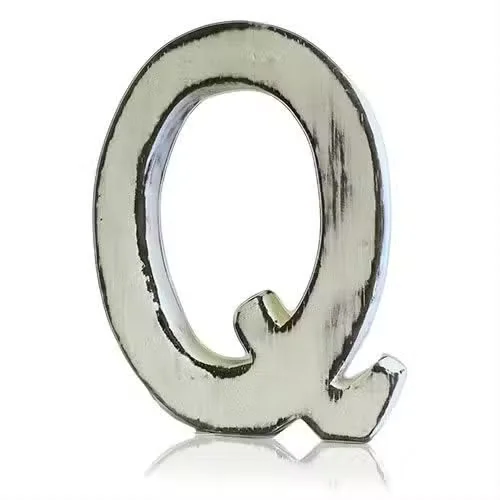 Shabby chic letter Q on a plain background.