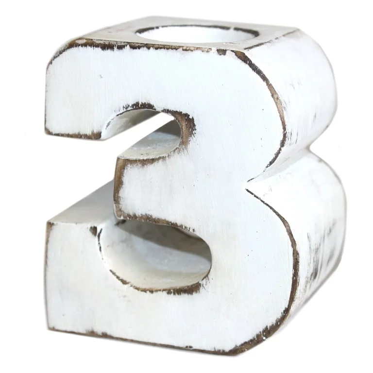Wooden birthday number 3 displayed on a plain white surface.