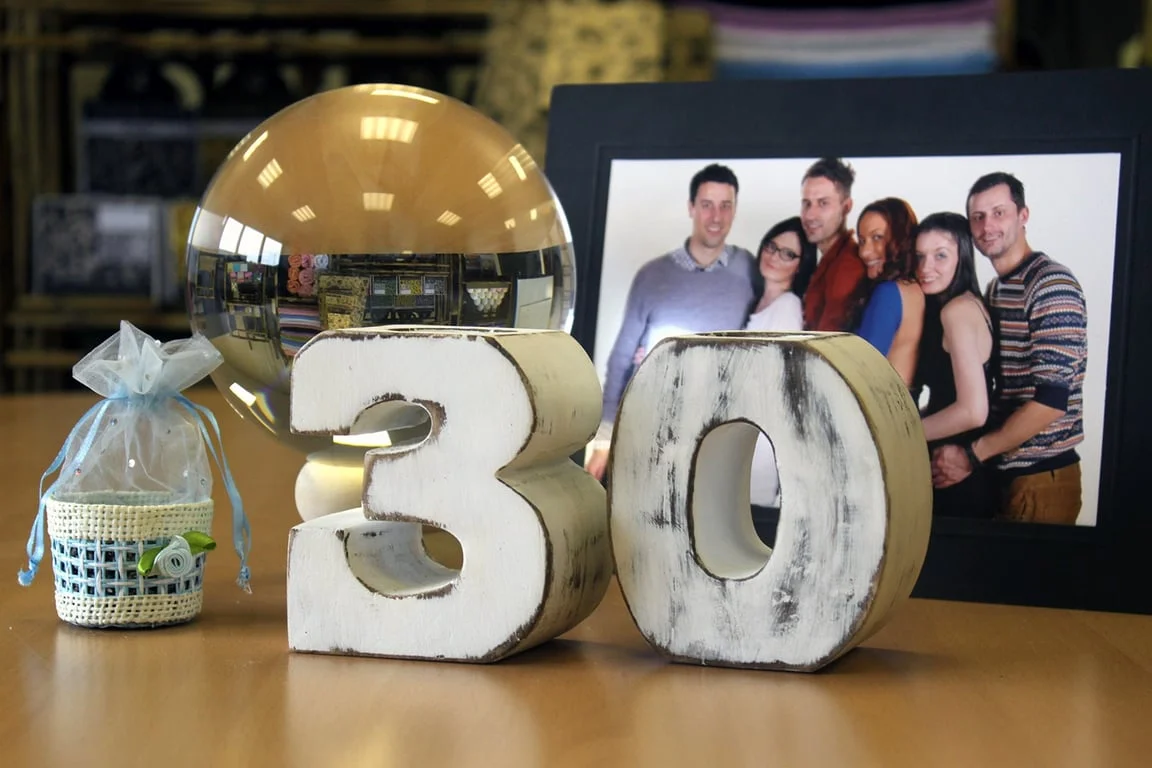 Wooden birthday number 3 on a plain background