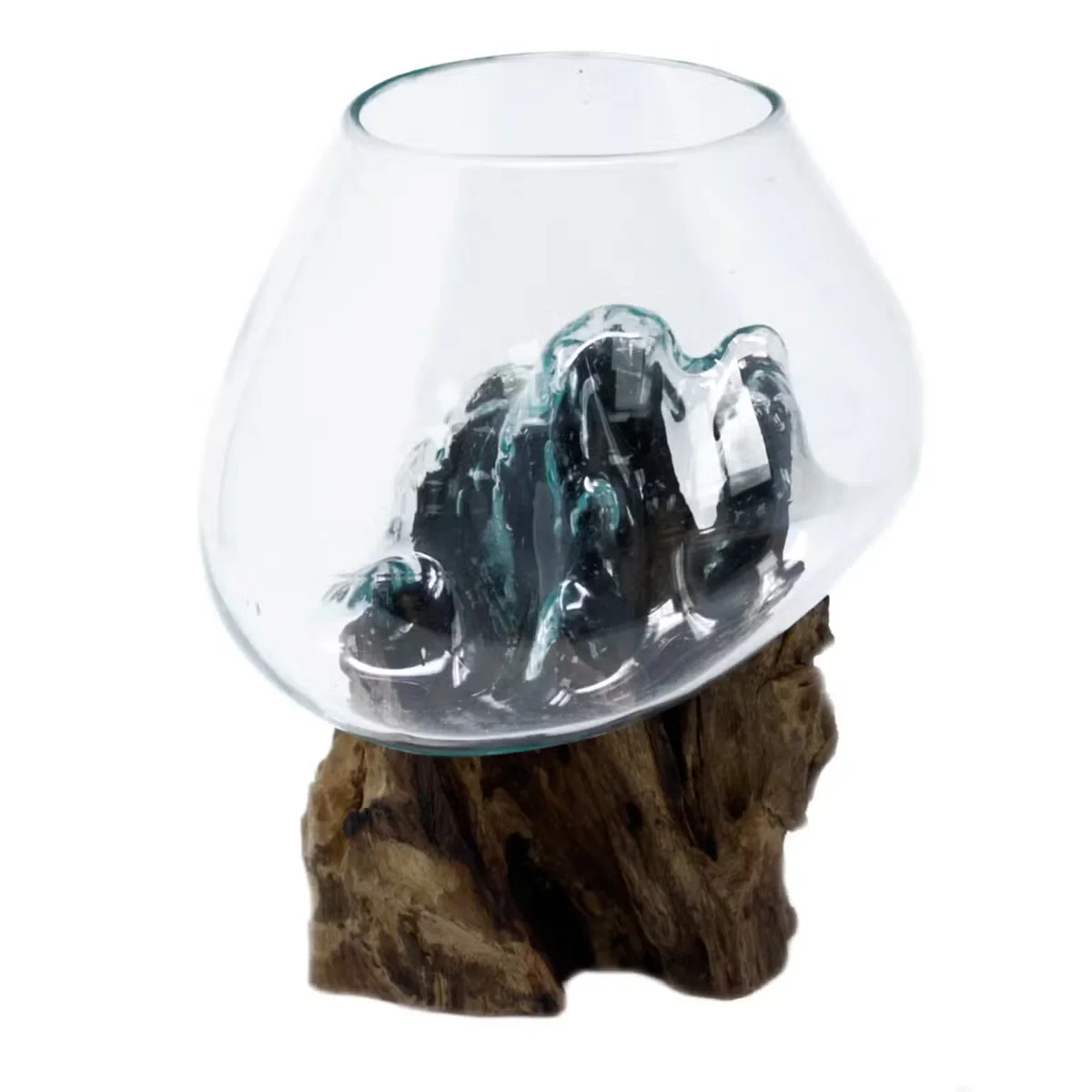 Large decorative glass bowl resting on a wooden surface, showcasing molten glass design.