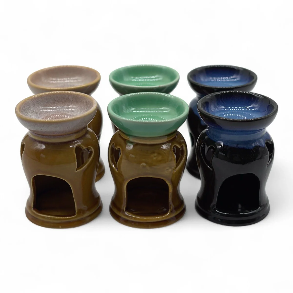 Classic rustic heart oil burner with carved heart cut-out, wooden design, polished surface.