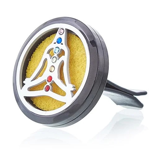 Pewter yoga chakra car diffuser kit, 30mm, displayed on a car dashboard.