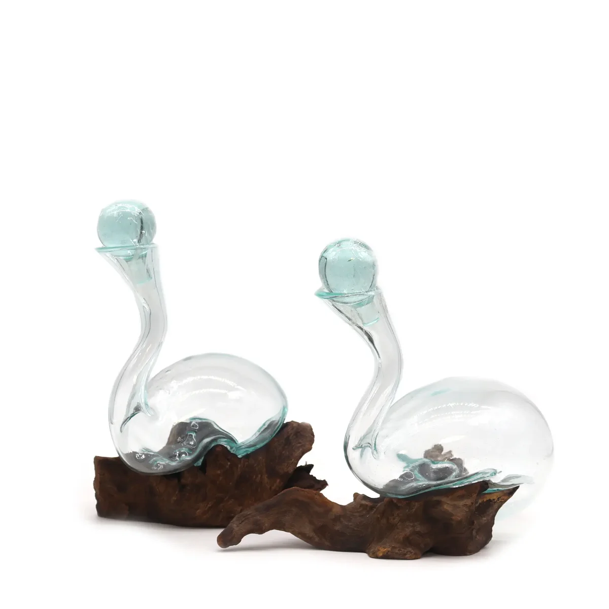 Glass wine decanter on a wooden slab, featuring a molten glass design.