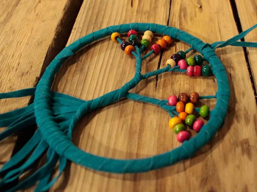 12cm Tree of Life dreamcatcher wall hanging decor with assorted designs and feathers on a white background