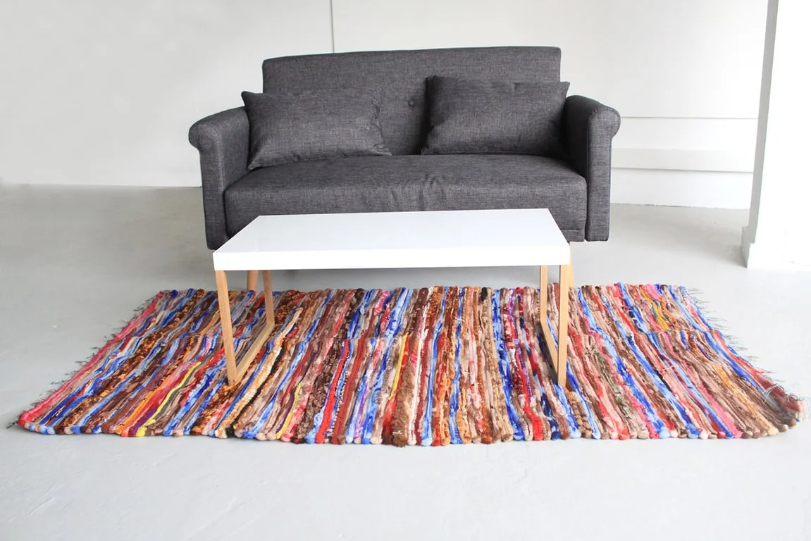 Large velvet floor rug showing its 105x185cm dimensions.
