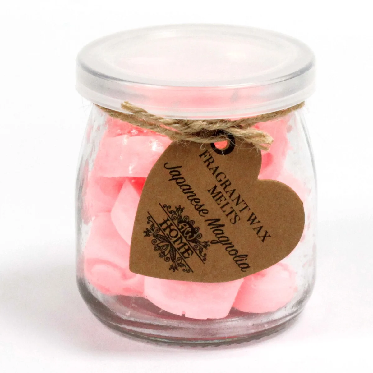 Soy wax melts inside a clear glass jar, showcasing a fragrant Japanese Magnolia scent.