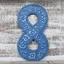 Assorted‑coloured 15cm number 8 wall decor.