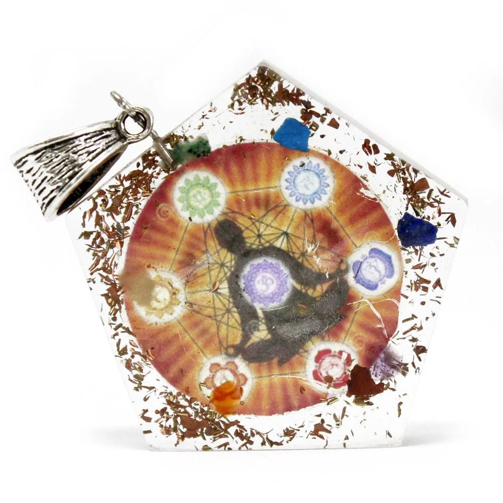 Orgonite pendant featuring a pentagon chakra design with clear resin beads and embedded crystals.