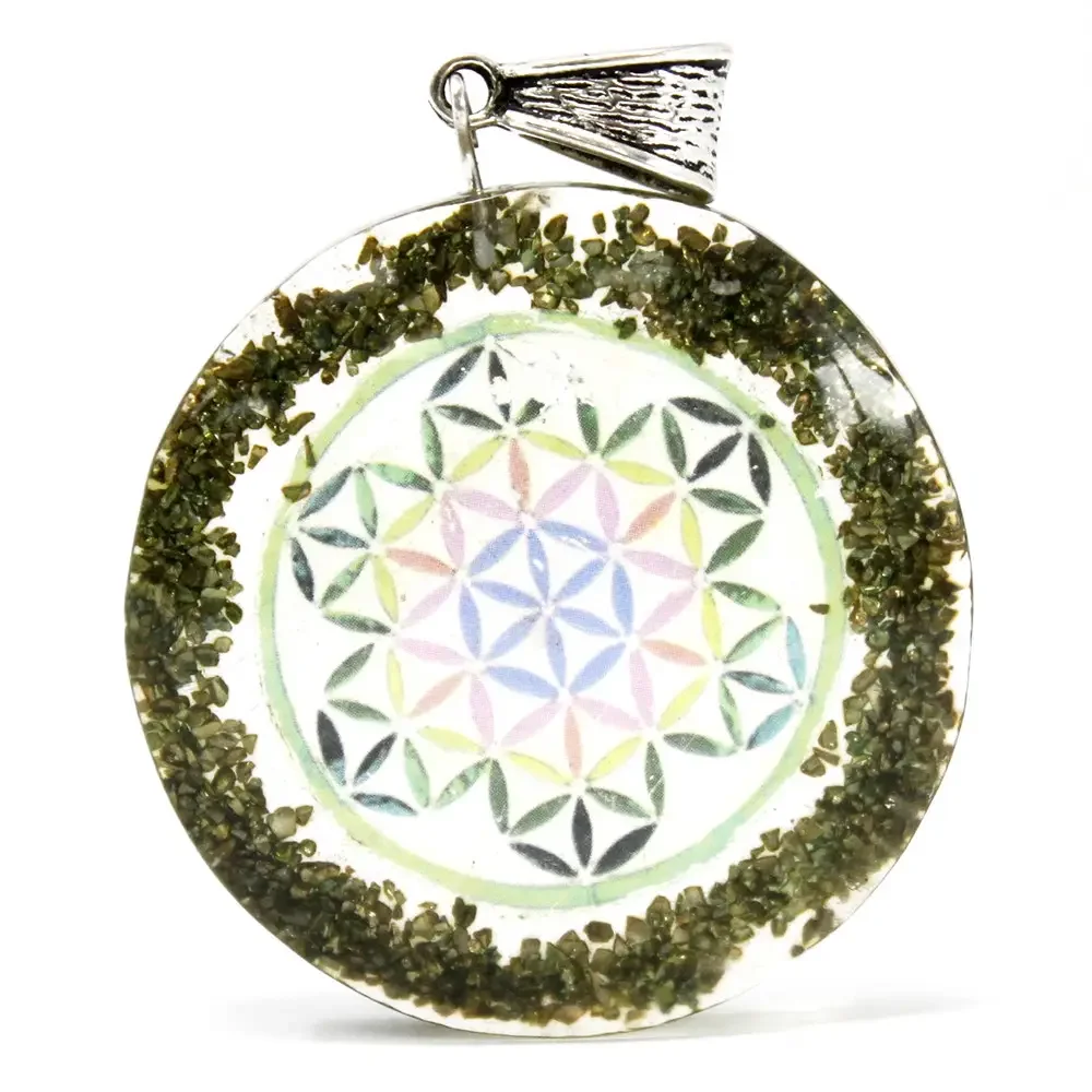 Greenstone mandala pendant featuring crystallised ore on a curved base.