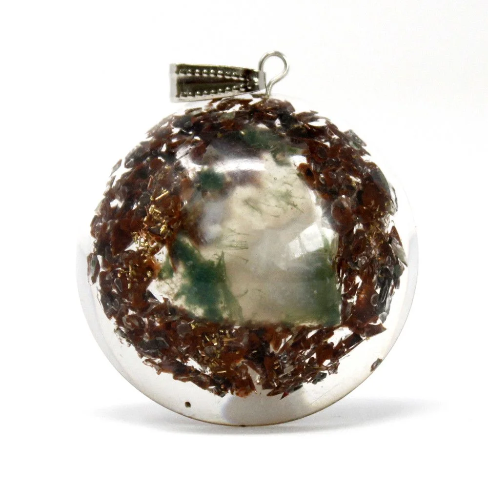Orgonite power pendant featuring a power block encased in a dome.