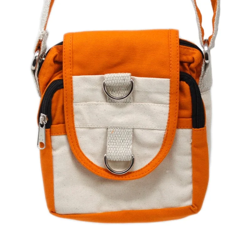 Turmeric‑colored natural travel bag displayed against a simple fabric background.