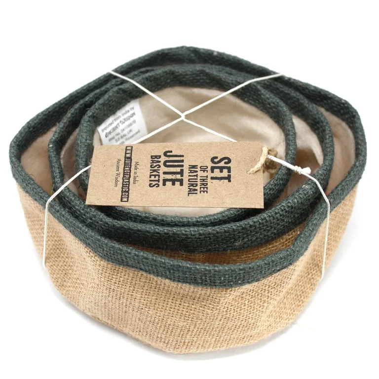 Set of three charcoal natural jute baskets arranged on a wooden surface