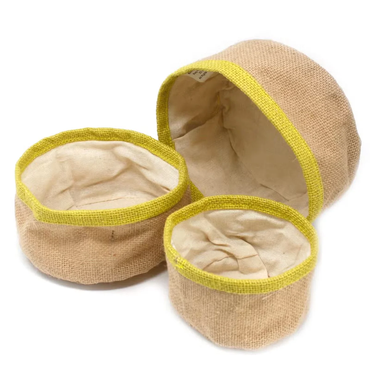 Set of 3 olive natural jute storage baskets set in varying sizes stacked together on a white background