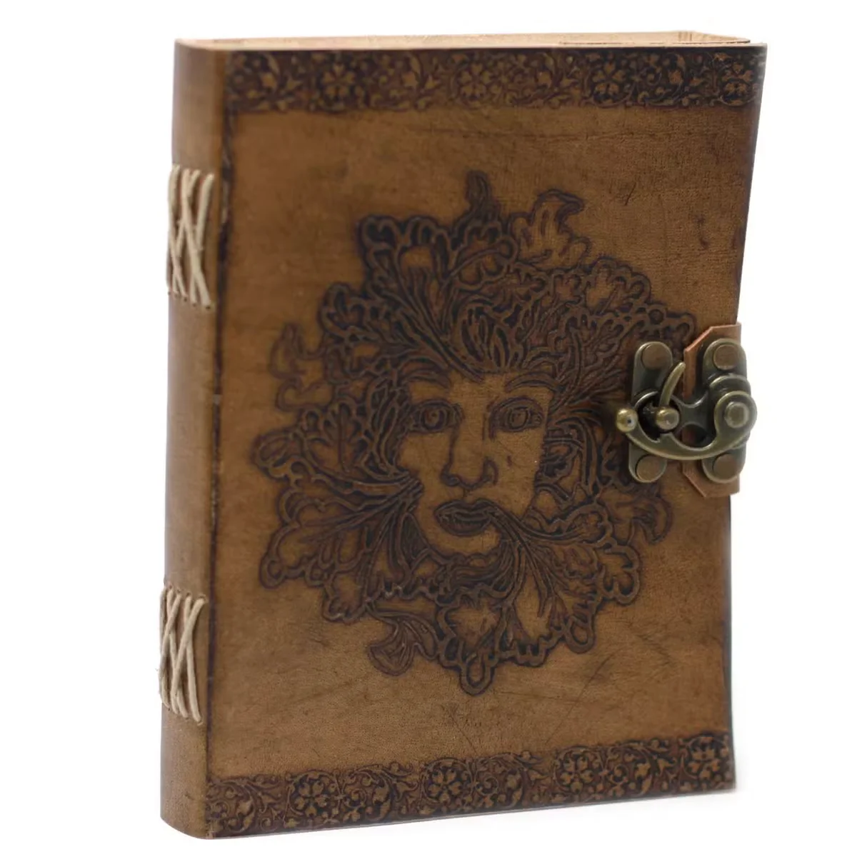 Greenman leather journal with embossed cover, 6x8 inches, closed and resting on a wooden surface