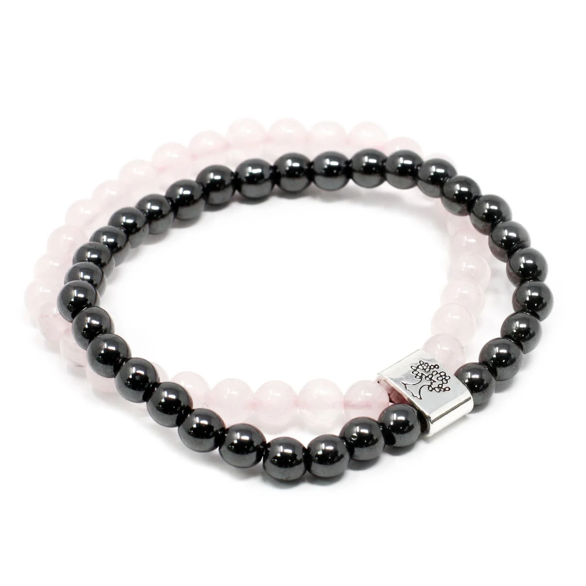 Magnetic gemstone bracelet with rose quartz stones displayed against a neutral backdrop.