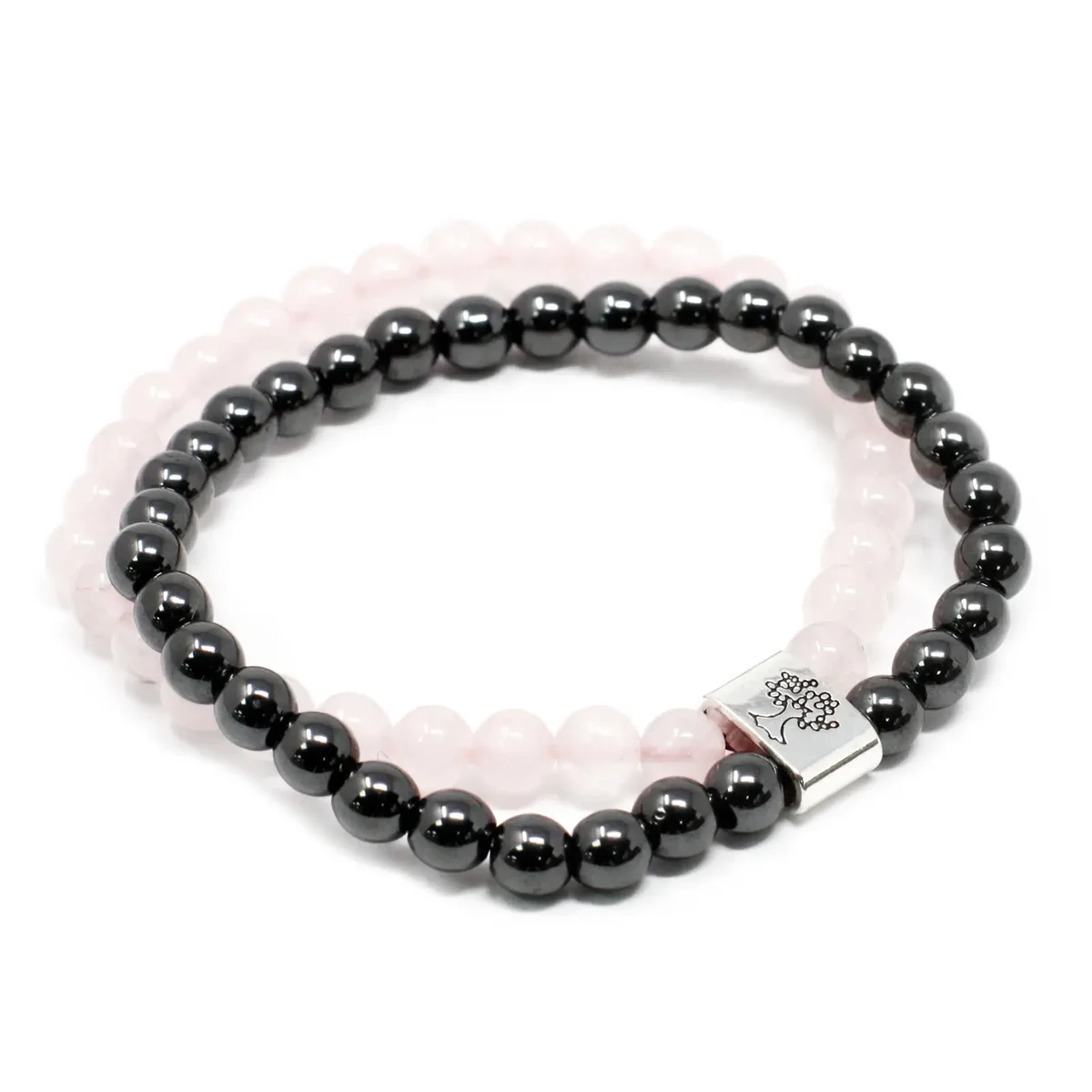 Close-up of a rose quartz bracelet with magnetic links and smooth strands