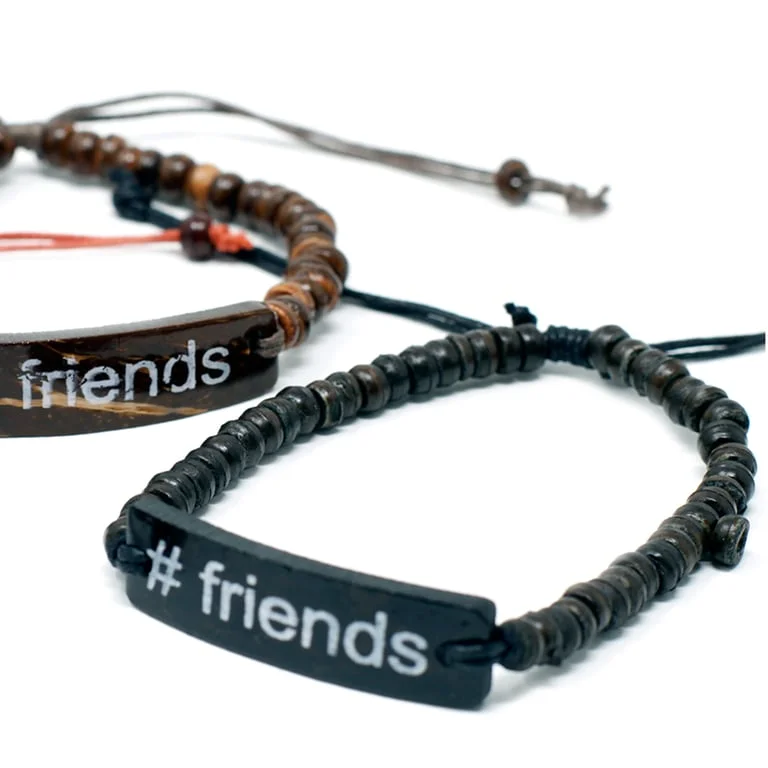 Coco slogan bracelet in colorful design worn on a wrist.