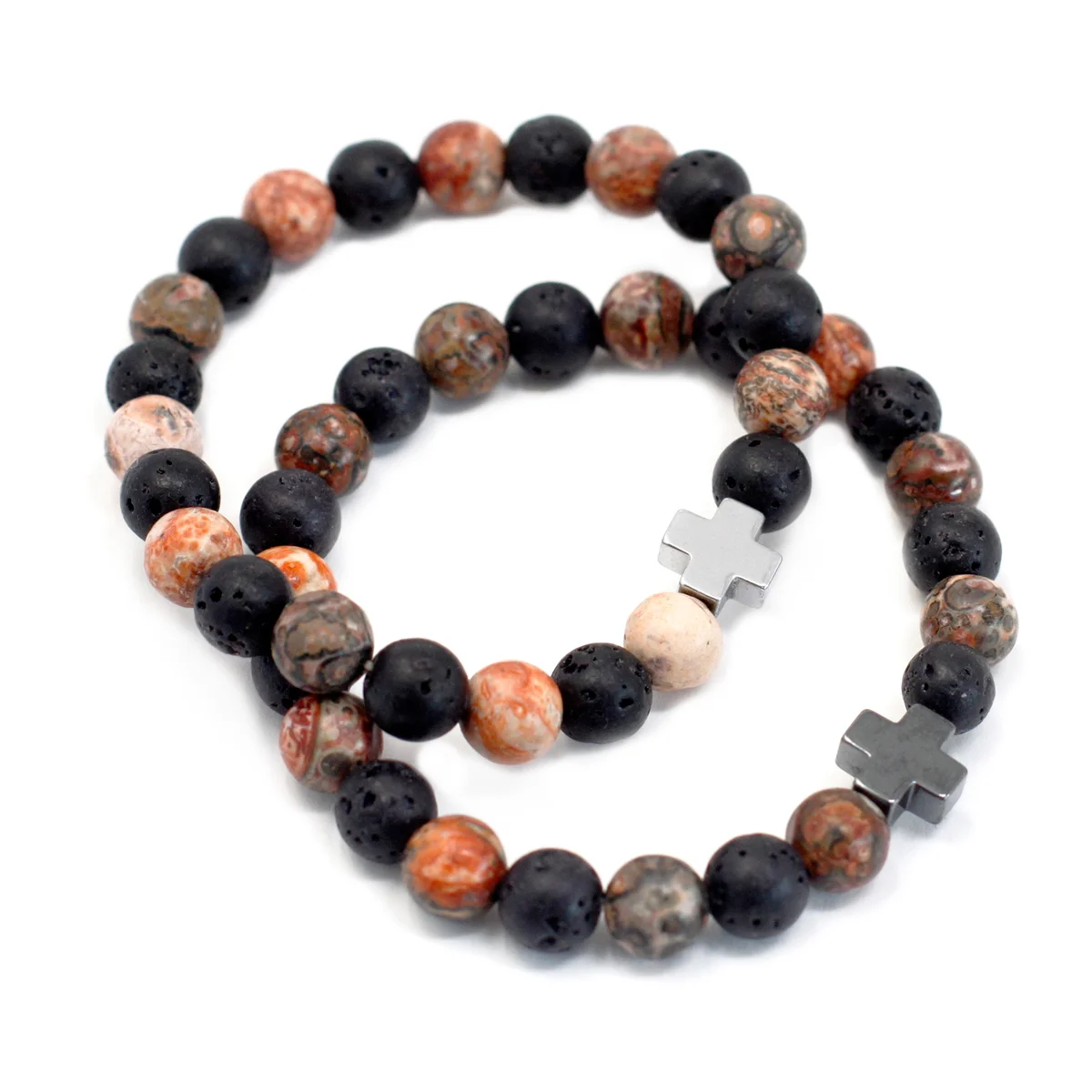 Lava stone bracelet set shows two friendship bracelets with leopard skin jasper accents hand‑held on a neutral background.