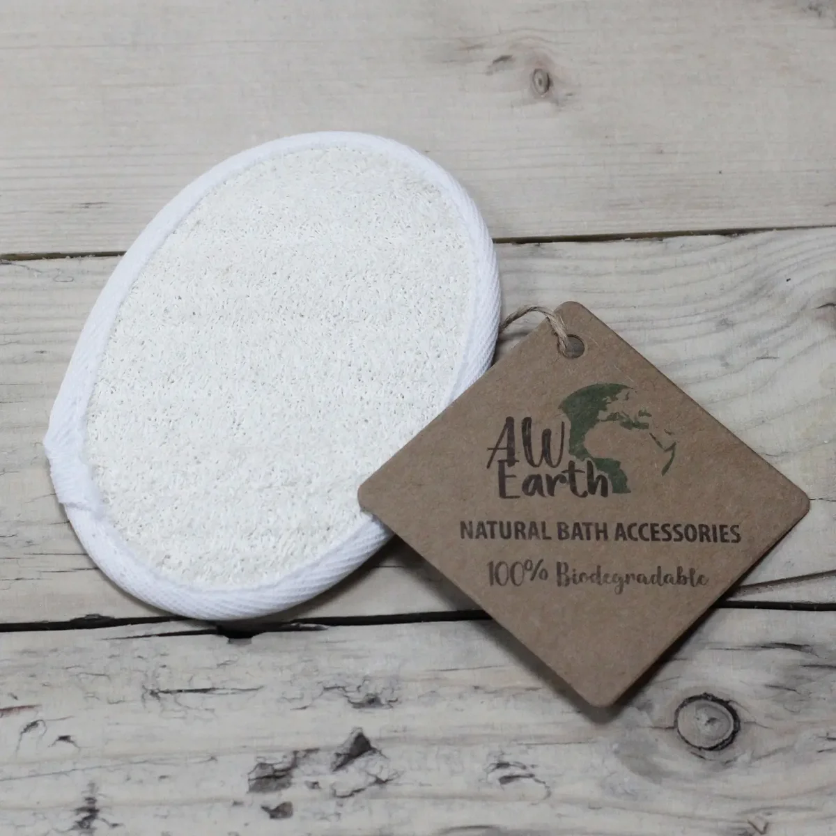 Oval natural loofah body scrub shown on a simple background, highlighting its natural texture.