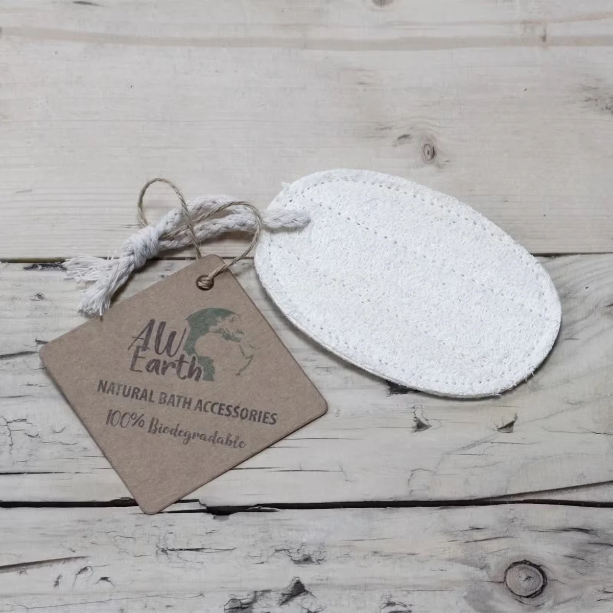 Natural loofah bath scrub in oval-shaped loofah body scrub container, showing textured loofah surface