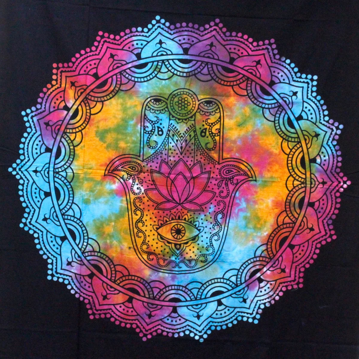 Black hamsa bedspread in black cotton fabric with matching wall hanging displayed on bed