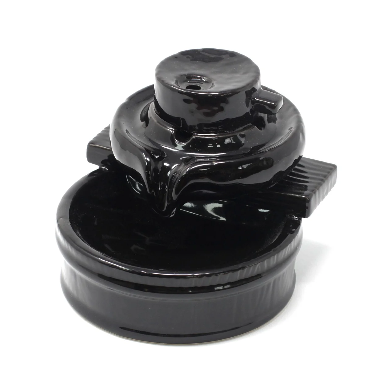 Ceramic backflow incense burner with a Zen flow design, releasing smoke that cascades downward elegantly