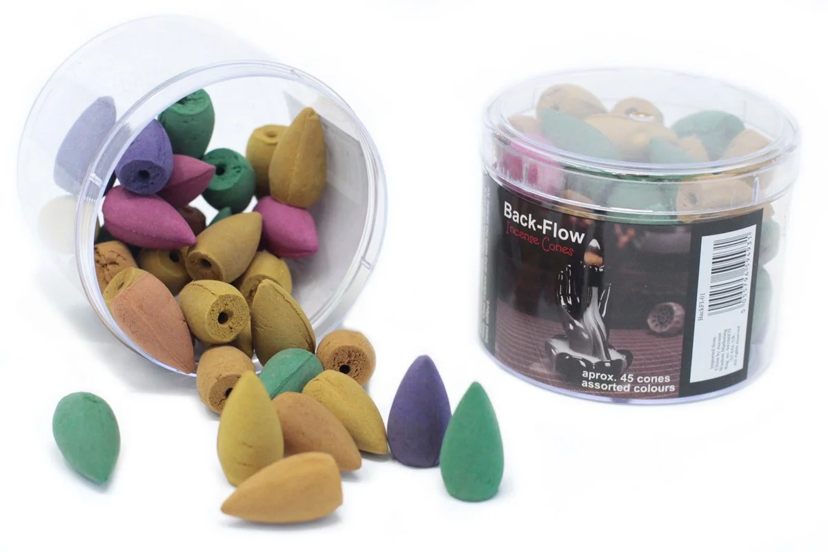 Tub of approximately 45 assorted back flow incense cones in various colors and shapes on a white background