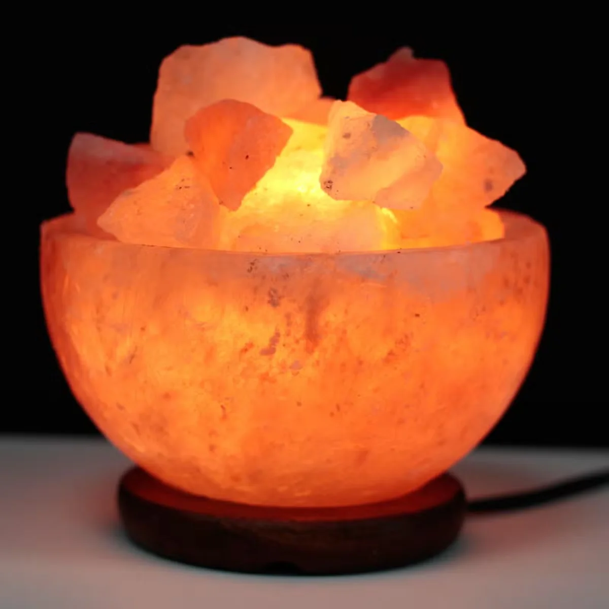 Salt fire bowl with salt chunks measuring 15cm by 9cm, ideal home fire decor for cozy ambiance
