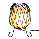 Mesh salt rock brazier holding white salt chunks, with electric cable and bulb.
