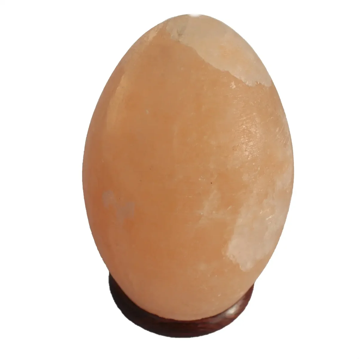 Egg-shaped salt lamp with a warm glow sitting on a smooth wooden base lamp for ambient lighting