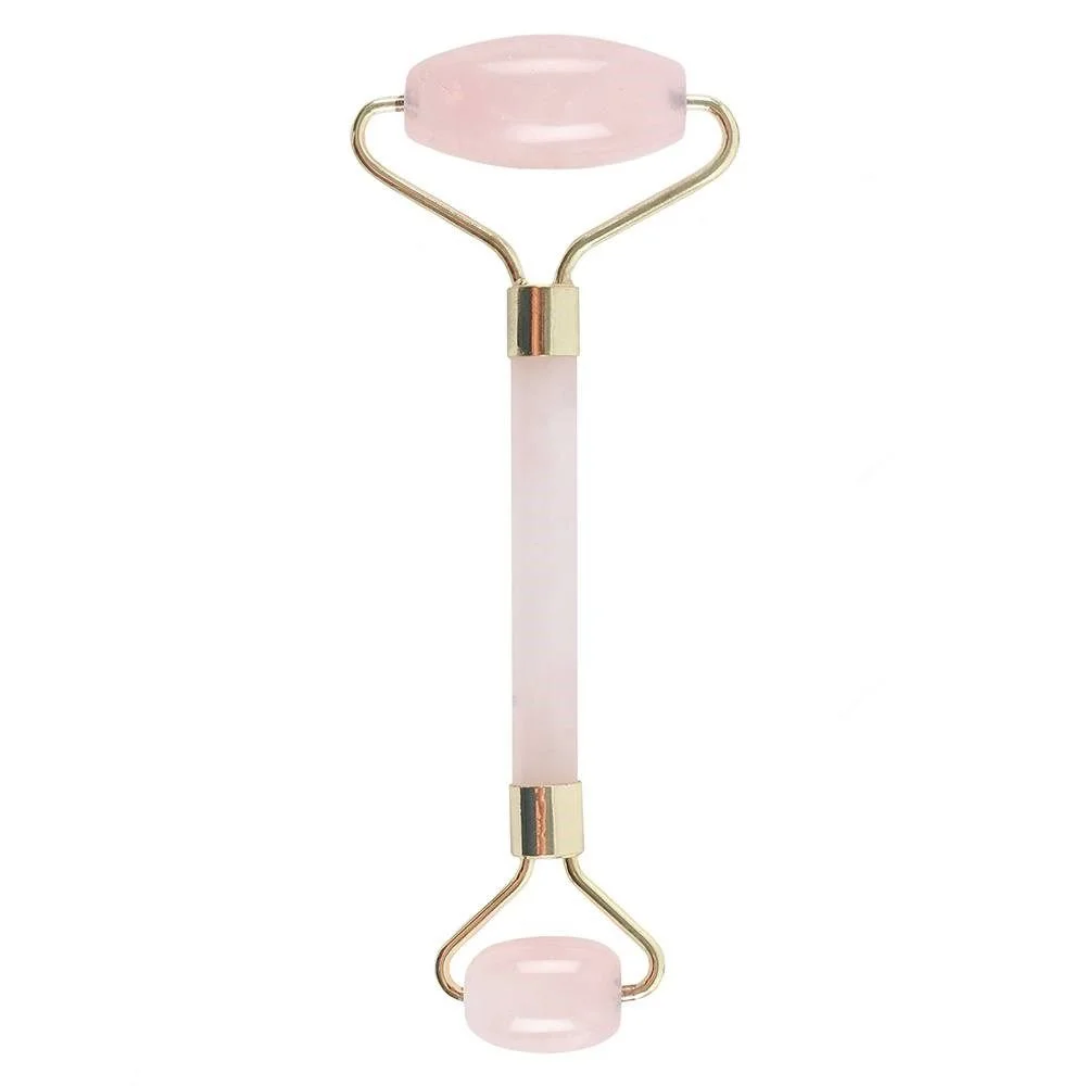 Rose quartz face roller with smooth pink gemstone and wooden handle for facial massage and skincare routines