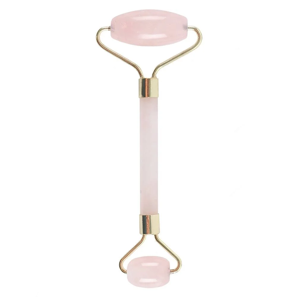 Rose quartz facial massage roller with smooth gemstone surfaces for skincare and relaxation, shown on white background